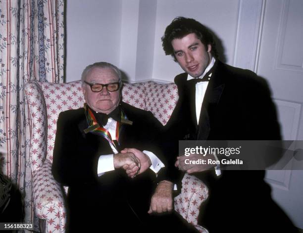 Actor James Cagney, wife Frances Cagney and actor John Travolta pose for photographs on December 7, 1980 at James Cagney's suite at The Fairfax Hotel...