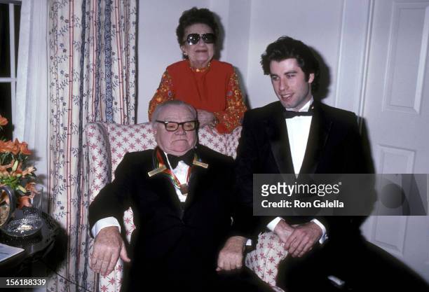 Actor James Cagney, wife Frances Cagney and actor John Travolta pose for photographs on December 7, 1980 at James Cagney's suite at The Fairfax Hotel...
