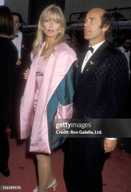 Actress Heather Thomas and date Harry M. Brittenham attend the 'Celebration of Tradition' A Gala Event Gathering Warner Bros. Stars on June 20, 1990...