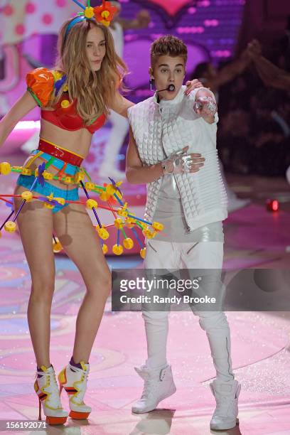 Model Dorothea Barth Jorgensen with Justin Bieber as he performs during the 2012 Victoria's Secret Fashion Show at the Lexington Avenue Armory on...