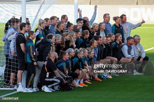 Germany's players and staff members pose for a group photograph during a training session at Jubilee Stadium in Sydney on July 29 on the eve of their...