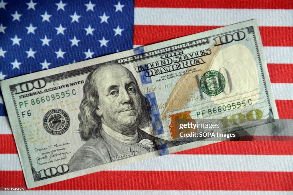 Displayed In this photo illustration, a $100 bill is displayed with the... News ...