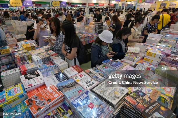 People visit the 33rd Hong Kong Book Fair, organised by the Hong Kong Trade Development Council , at the Hong Kong Convention and Exhibition Centre...