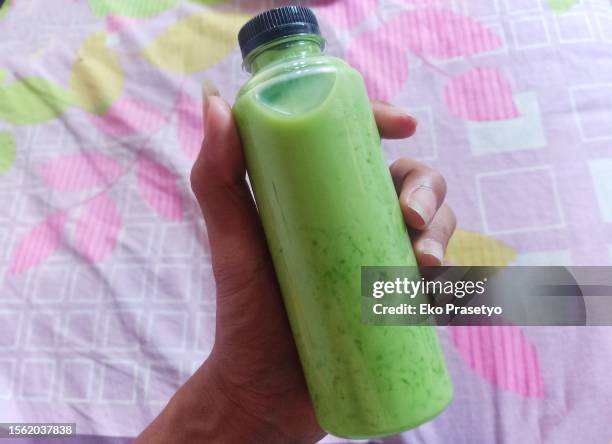 melon milk in a plastic bottle - yoghurt lid stock pictures, royalty-free photos & images