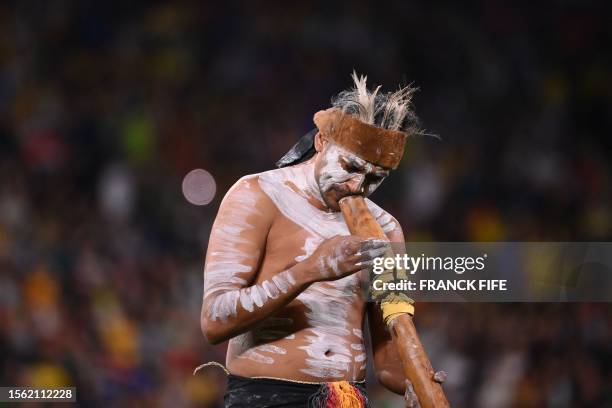 Performer takes part in a cultural welcome ceremony before the start of the Australia and New Zealand 2023 Women's World Cup Group F football match...