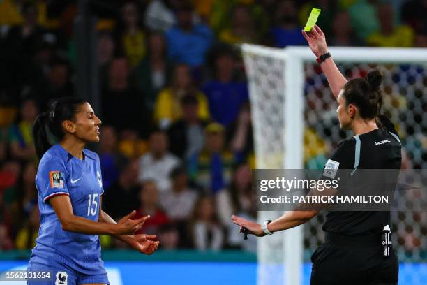 Australian referee Kate Jacewicz shows a yellow card to France's midfielder Kenza Dali during the Australia and New Zealand 2023 Women's World Cup...