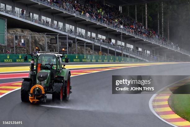 Technical vehicle blow air to clear rainwater from the track before the sprint shootout ahead of the Formula One Belgian Grand Prix at the...