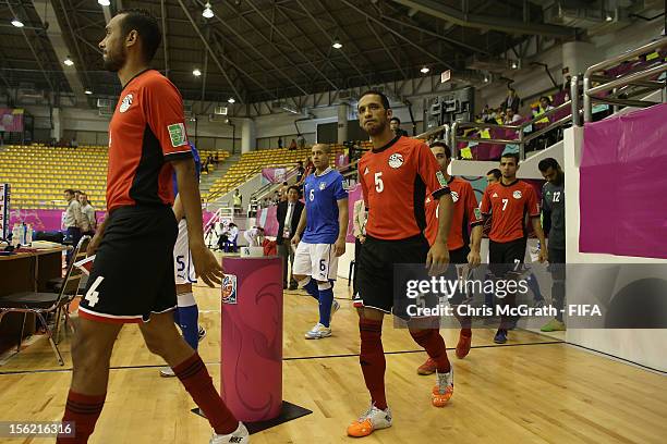 Teams walk onto the pitch during the FIFA Futsal World Cup, Round of 16 match between Italy and Egypt at Korat Chatchai Hall on November 12, 2012 in...