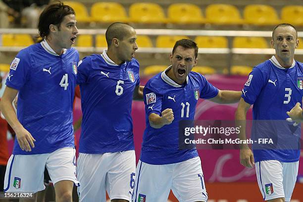 Saad Assis of Italy celebrates scoring a goal with team mates against Egypt during the FIFA Futsal World Cup, Round of 16 match between Italy and...