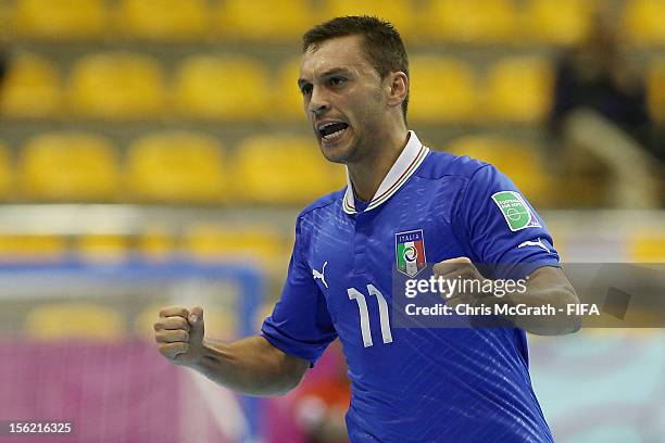 Saad Assis of Italy celebrates scoring a goal against Egypt during the FIFA Futsal World Cup, Round of 16 match between Italy and Egypt at Korat...