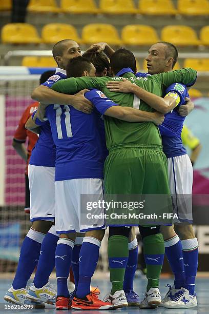 Saad Assis of Italy cis congratulated by team mates after scoring a goal against Egypt during the FIFA Futsal World Cup, Round of 16 match between...