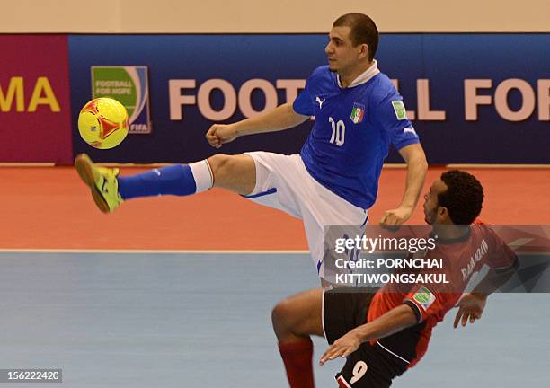 Jairo Dos Santos of Italy battles for the ball with Ramadan Samasry of Egypt during playoff for their quarter-final match of the FIFA Futsal World...