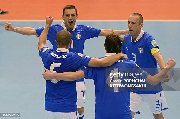 Saad Assis of Italy celebrates with teammates after scoring a goal against Egypt during their playoff for the quarter-final match of the FIFA Futsal...