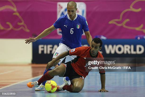Ramadan Samasry of Egypt protects the ball from Humberto Honorio of Italy during the FIFA Futsal World Cup, Round of 16 match between Italy and Egypt...