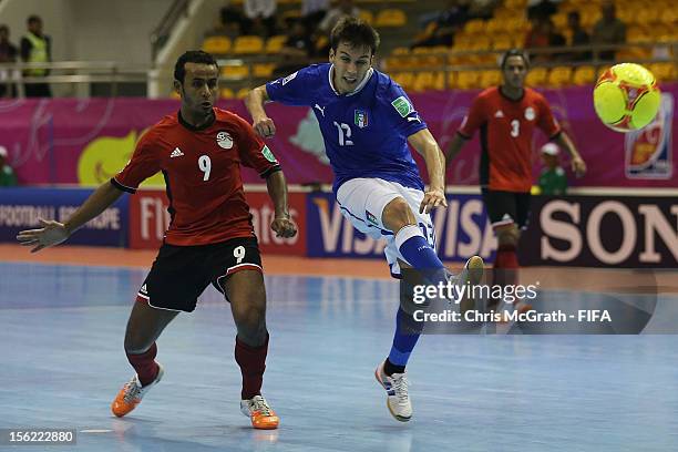 Gabriel Lima of Italy takes a shot at goal under pressure from Ramadan Samasry of Egypt during the FIFA Futsal World Cup, Round of 16 match between...