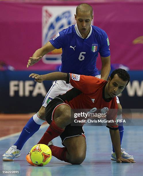 Ramadan Samasry of Egypt protects the ball from Humberto Honorio of Italy during the FIFA Futsal World Cup, Round of 16 match between Italy and Egypt...