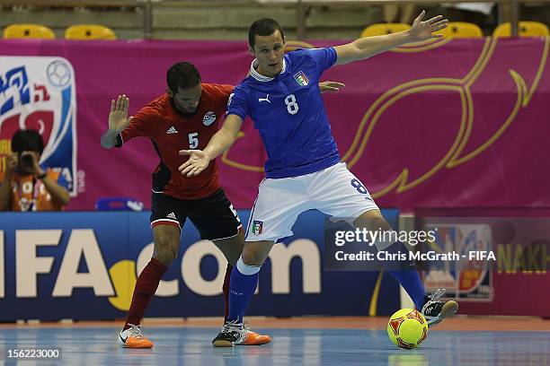 Rodolfo Fortino of Italy holds off Bougy of Egypt during the FIFA Futsal World Cup, Round of 16 match between Italy and Egypt at Korat Chatchai Hall...