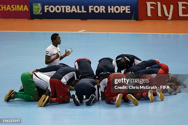Panama players pray prior to the start of the FIFA Futsal World Cup, Round of 16 match between Brazil and Panama at Korat Chatchai Hall on November...