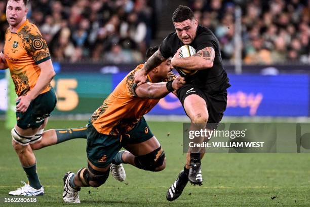 New Zealand's Codie Taylor breaks through the Australian defence in the Rugby Championship 2023 and Bledisloe Cup Test match between Australia and...