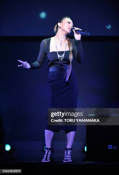 Japanese pop singer Kumi Koda sings her new song "stay with me" during a press conference of Japan's second largest mobile operator KDDI in Tokyo on...