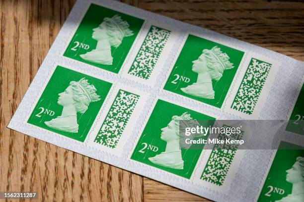 Books of barcoded Royal Mail 2nd class postage stamps depicting the head of Queen Elizabeth II on 29th July 2023 in St Dogmaels, Wales, United...