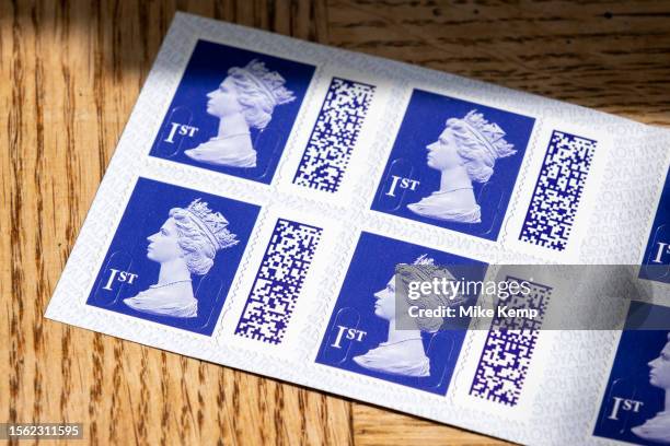 Books of barcoded Royal Mail 1st class postage stamps depicting the head of Queen Elizabeth II on 29th July 2023 in St Dogmaels, Wales, United...