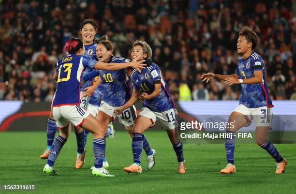 Mina Tanaka of Japan celebrates with teammates after scoring her team's first goal before disallowed due to offside during the FIFA Women's World Cup...