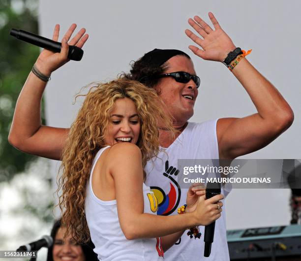 Colombian singers Shakira and Carlos Vives perform during a concert in support of hostage liberation held as part of Colombia's independence day...