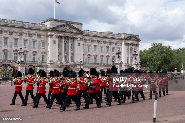 Tourists and domestic visitors at Buckingham Palace watch in huge numbers as Changing of the Guard takes place of the King's Guard comprised of...