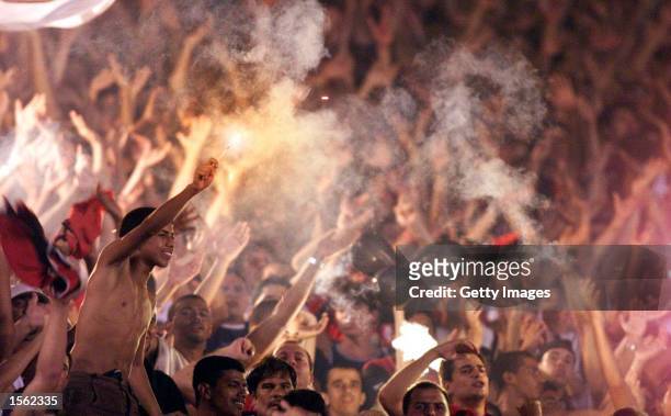 Flamengo fans let off flares in the stands during the Flamengo v Vasco de Gama Joao Havelange Cup match played at the Maracana Stadium, Rio de...