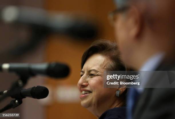 Zeti Akhtar Aziz, governor of Bank Negara Malaysia, left, speaks during a news conference in Seoul, South Korea, on Monday, Nov. 12, 2012. South...