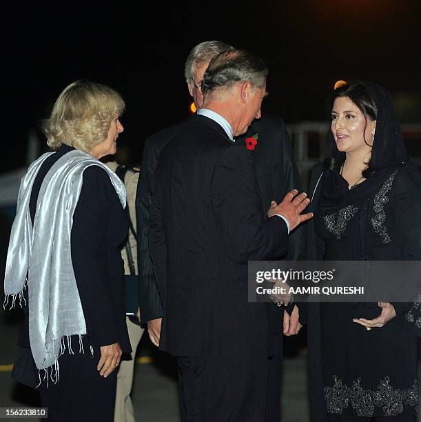Britain's Prince Charles and his wife Camilla , Duchess of Cornwall, are greeted by Pakistani Womens' Affairs Minster Sumera Malik at their arrival...