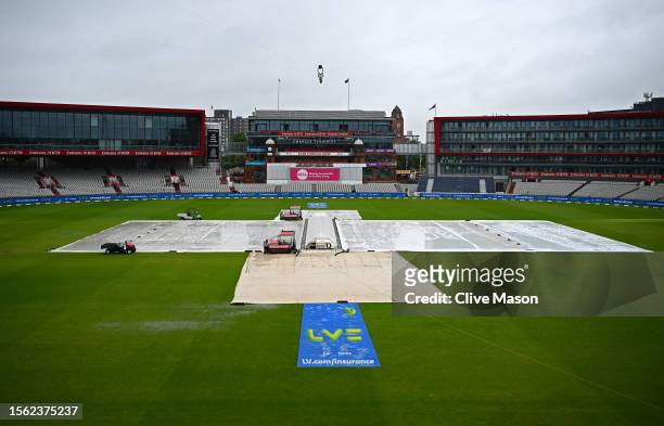 The covers are on at Old Trafford ahead of play on day four of the LV=Insurance Ashes 4th Test Match between England and Australia at Emirates Old...