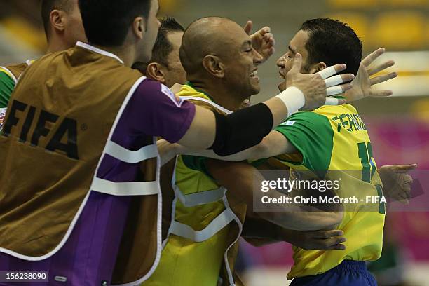 Fernandinho of Brazil celebrates with the bench after scoring a goal against Panama during the FIFA Futsal World Cup, Round of 16 match between...
