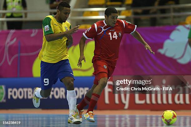 Enrique Valdes of Panama contests the ball with Je of Brazil during the FIFA Futsal World Cup, Round of 16 match between Brazil and Panama at Korat...