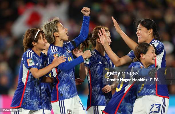 Mina Tanaka of Japan celebrates with teammates after scoring her team's second goal later disallowed due to offside during the FIFA Women's World Cup...