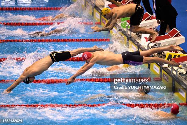 S Matt King , Britain's Duncan Scott and Australia's Kyle Chalmers dive in the final of the mixed 4x100m freestyle relay swimming event during the...