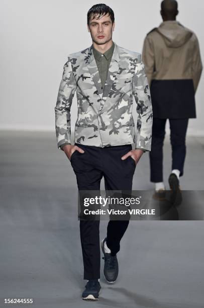 Model walks the runway during the R Groove Fall/Winter 2013 fashion show at Fashion Rio on November 09, 2012 in Rio de Janeiro, Brazil.