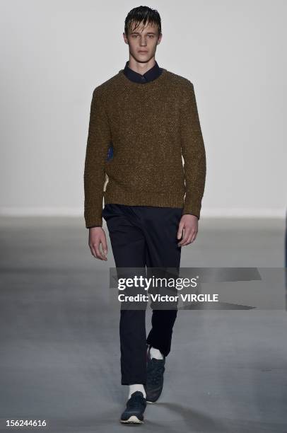 Model walks the runway during the R Groove Fall/Winter 2013 fashion show at Fashion Rio on November 09, 2012 in Rio de Janeiro, Brazil.