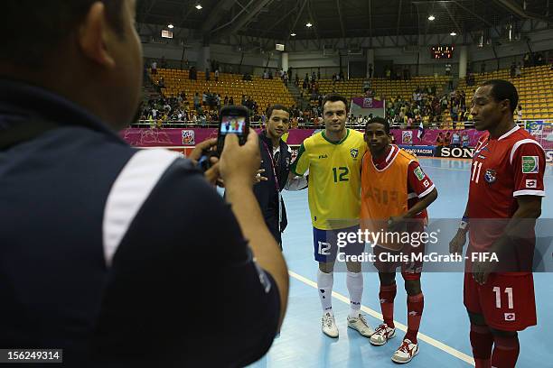 Falcao of Brazil poses for a picture with members of the Panama team during the FIFA Futsal World Cup, Round of 16 match between Brazil and Panama at...