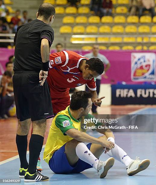 Fernando Mena of Panama waves his finger at Falcao of Brazil after knocking him to the ground during the FIFA Futsal World Cup, Round of 16 match...