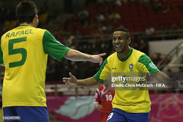 Je of Brazil is congratulated by team mate Rafael after scoring a goal against Panama during the FIFA Futsal World Cup, Round of 16 match between...