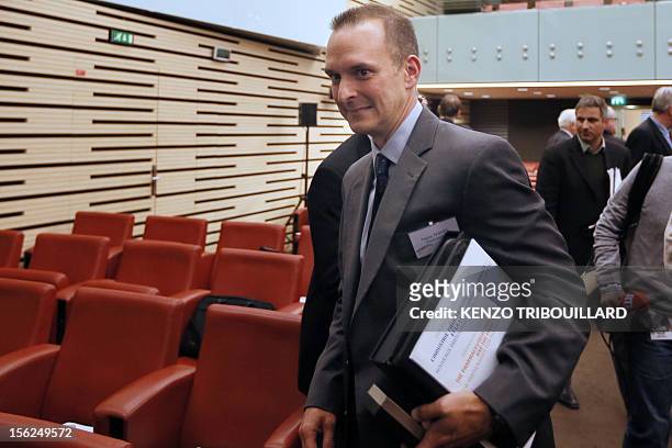 Travis T. Tygart , CEO of the U.S. Anti-Doping Agency leaves an anti-doping conference on November 12, 2012 in Paris. AFP PHOTO/KENZO TRIBOUILLARD