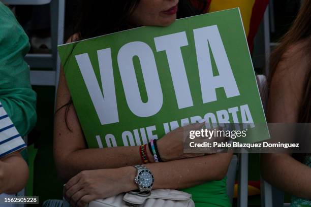 Supporter of far right wing party VOX holds a placard reading 'Vote what matters' during the VOX closing rally ahead of Spanish general election on...