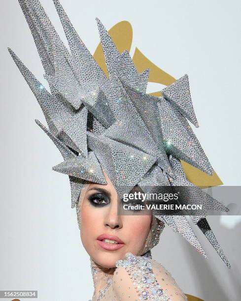 Lady Gaga poses with her awards during the 52nd annual Grammy Awards in Los Angeles, California on January 31, 2010. AFP PHOTO / VALERIE MACON