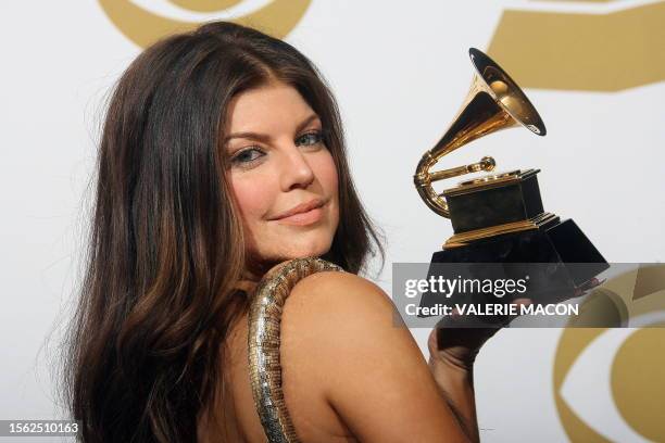 Fergie poses with her award during the 52nd annual Grammy Awards in Los Angeles, California on January 31, 2010. AFP PHOTO / VALERIE MACON