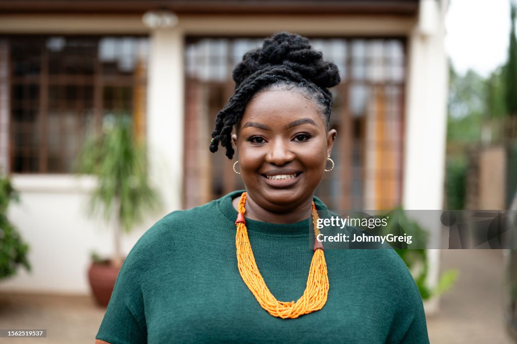Outdoor portrait of cheerful young Black woman