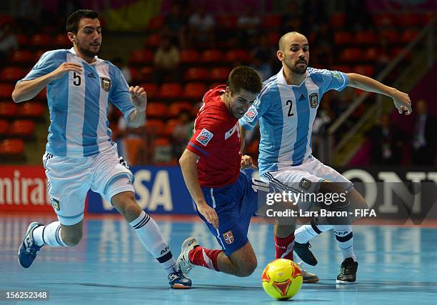 Mladen Kocic of Serbia is challenged by Damian Stazzone of Argentina during the FIFA Futsal World Cup Round of 16 match between Serbia and Argentina...