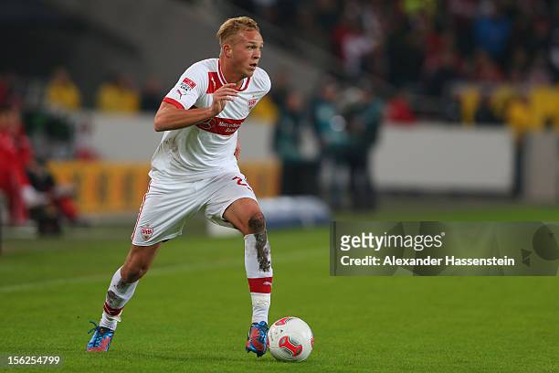 Raphael Holzhauser of Stuttgart runs with the ball with during the Bundesliga match between VfB Stuttgart and Hannover 96 at Mercedes-Benz Arena on...