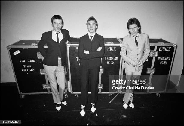 British new wave group The Jam pose with their individual wardrobe flight cases backstage at the Gaumont, Southampton, during their British tour,...